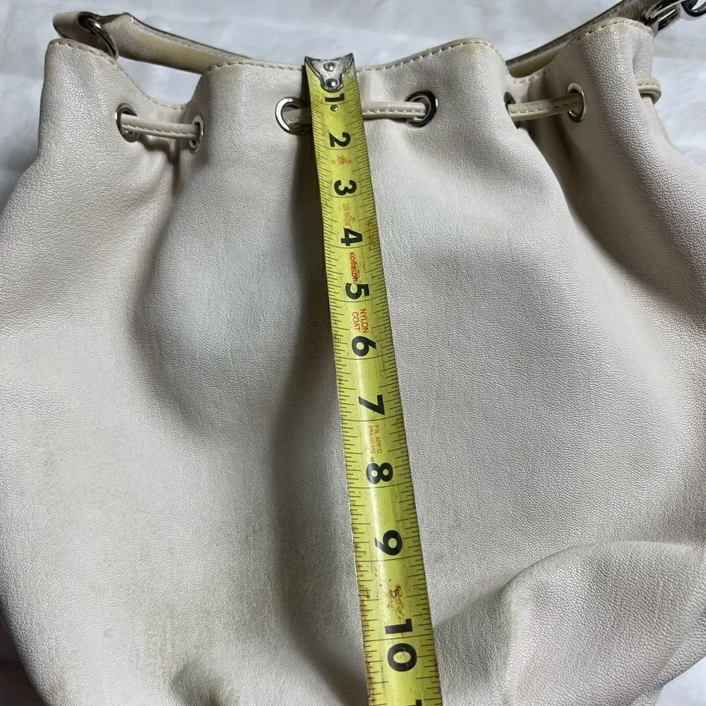 Michael Michael Kors leather beige drawstring bucket satchel.silver tone accents